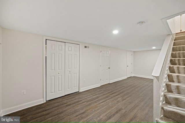 basement featuring dark hardwood / wood-style floors