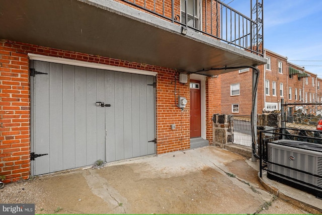 property entrance featuring central AC unit