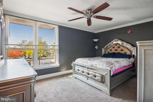 bedroom featuring ornamental molding, carpet floors, and ceiling fan