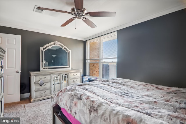 bedroom featuring crown molding, light colored carpet, and ceiling fan