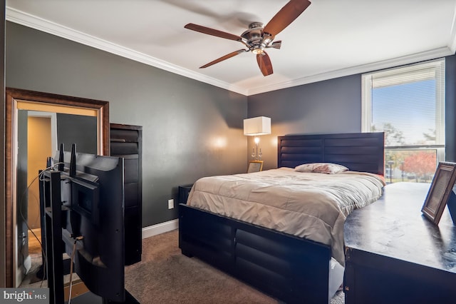 carpeted bedroom featuring ceiling fan and ornamental molding