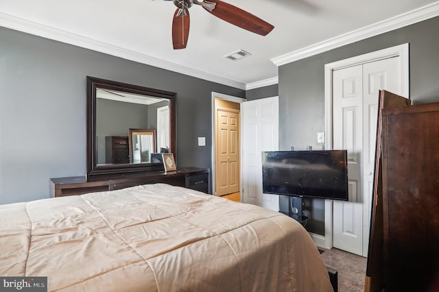 carpeted bedroom featuring ceiling fan and ornamental molding