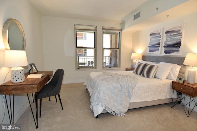 bedroom with light colored carpet