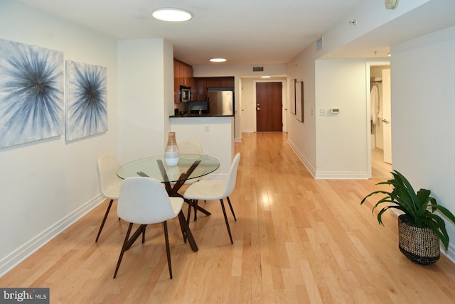 dining area featuring light hardwood / wood-style floors