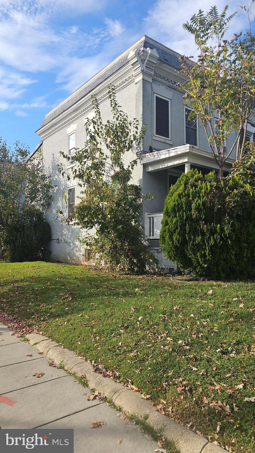 view of side of home featuring a yard