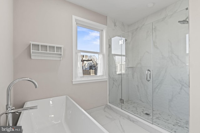 bathroom featuring separate shower and tub