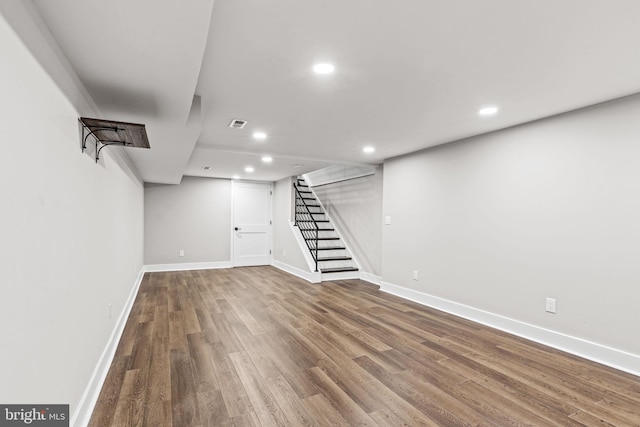 basement featuring hardwood / wood-style flooring