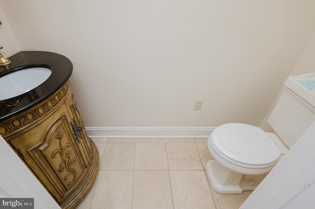 bathroom with tile patterned flooring, toilet, and sink