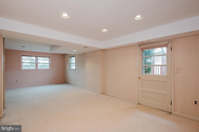 basement featuring carpet and plenty of natural light