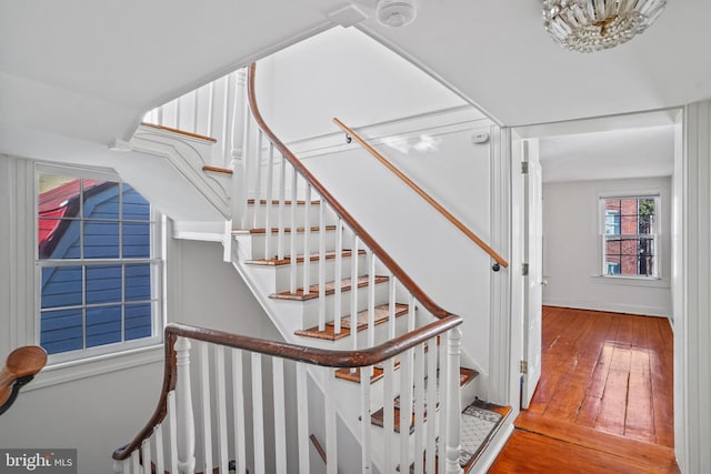 stairs featuring wood-type flooring