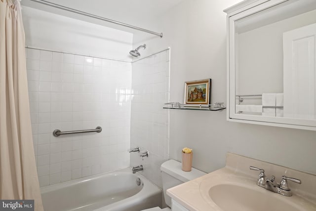 full bathroom with vanity, shower / tub combo with curtain, and toilet