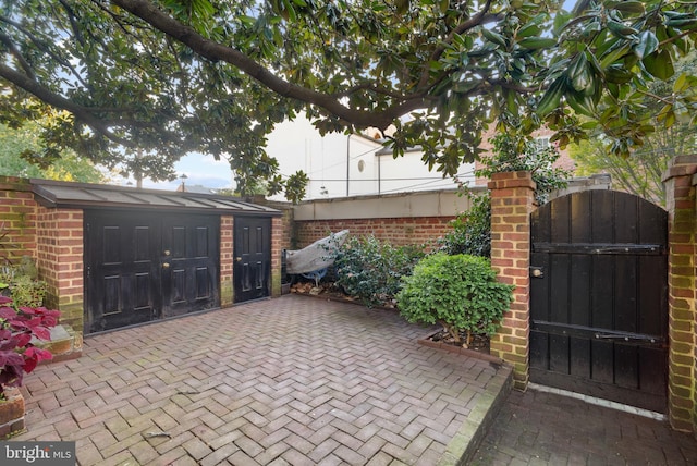 view of patio / terrace with a storage shed