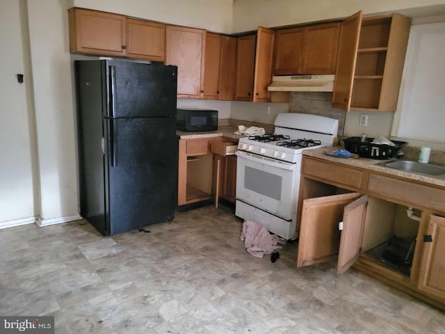 kitchen with sink and black appliances