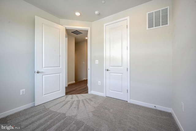 unfurnished bedroom with carpet