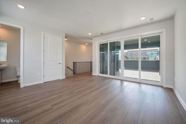 spare room featuring dark hardwood / wood-style flooring