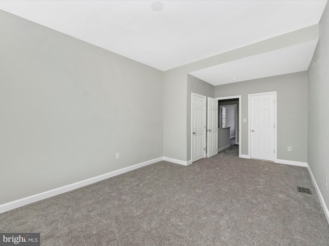 unfurnished bedroom featuring carpet