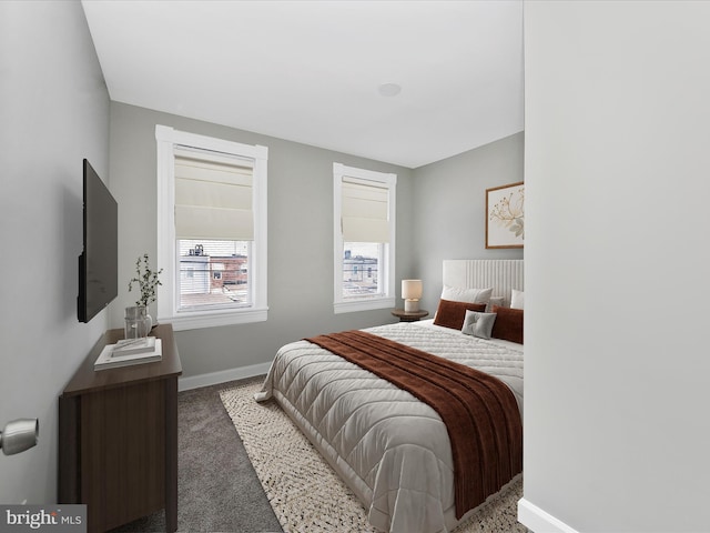 bedroom featuring dark colored carpet