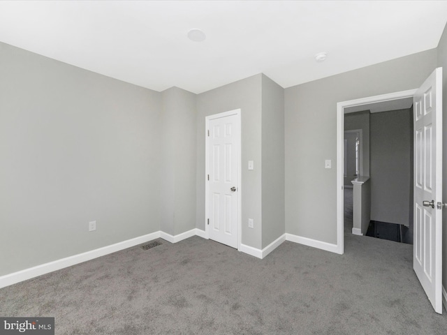 unfurnished bedroom featuring carpet