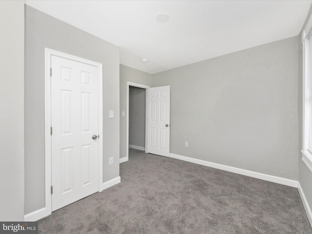 unfurnished bedroom with carpet floors