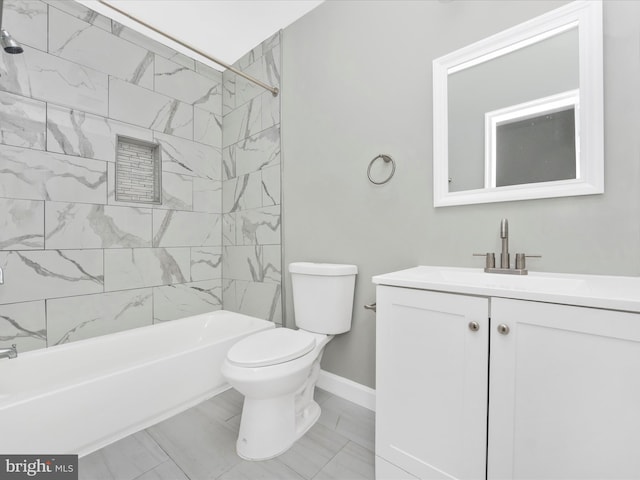 full bathroom with vanity, tiled shower / bath, and toilet