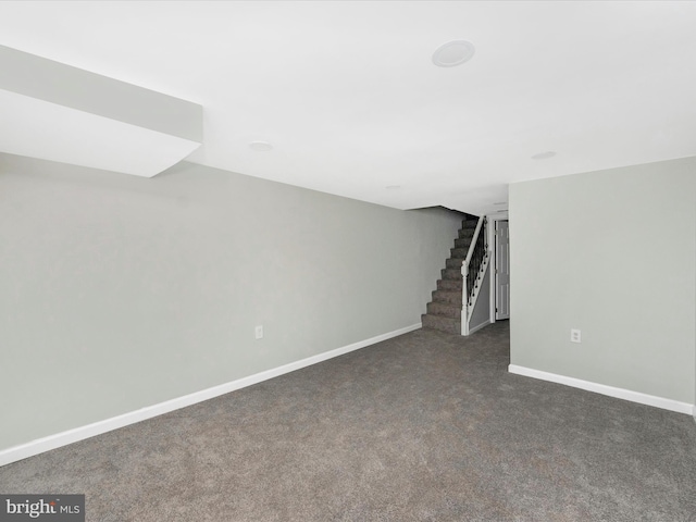 basement with dark carpet