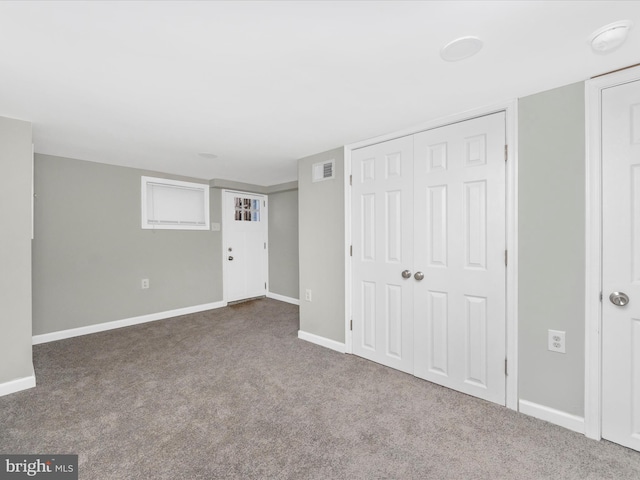 interior space featuring carpet floors and a closet