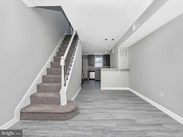 stairway with wood-type flooring