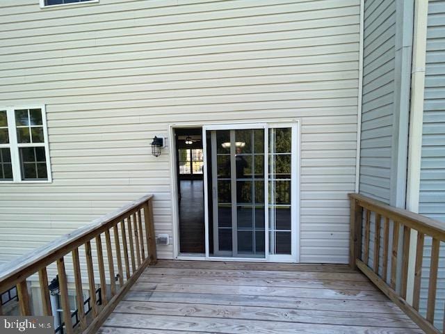 doorway to property featuring a wooden deck