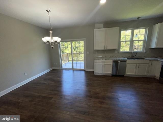 kitchen with pendant lighting, sink, stainless steel dishwasher, dark hardwood / wood-style flooring, and white cabinetry