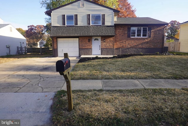 view of front of house with central AC unit, a front yard, and a garage