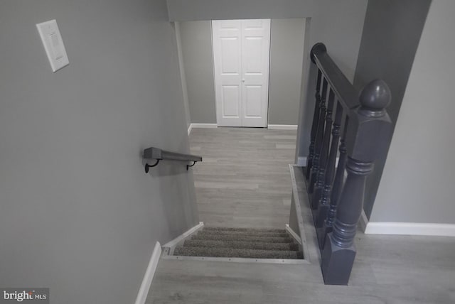 staircase featuring hardwood / wood-style flooring