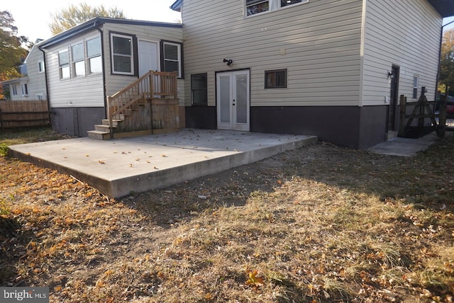 rear view of property with french doors and a patio area