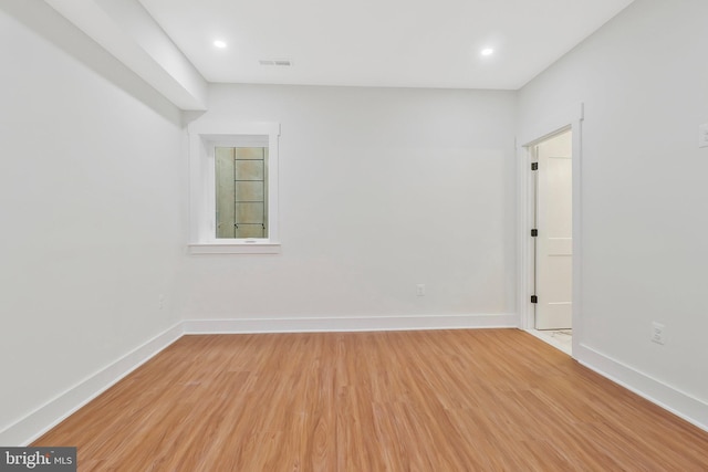 spare room with light wood-type flooring