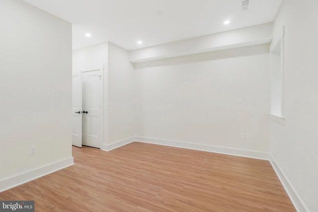 basement featuring light wood-type flooring