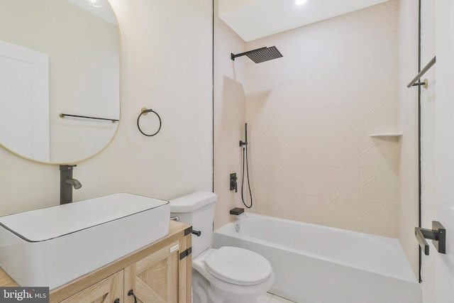 full bathroom with toilet, tiled shower / bath combo, vanity, and tile patterned floors