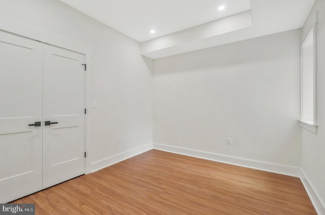 unfurnished room with light wood-type flooring