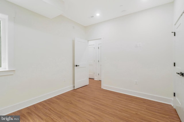 spare room featuring light hardwood / wood-style floors