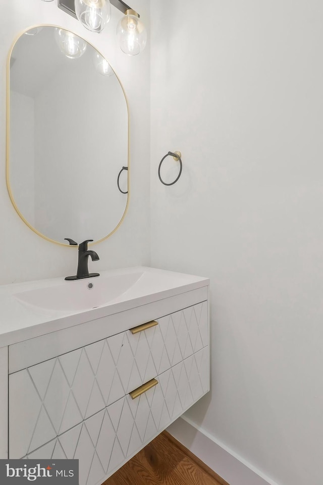 bathroom with vanity and hardwood / wood-style flooring