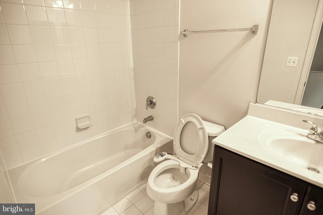 full bathroom with toilet, vanity, tiled shower / bath, and tile patterned flooring