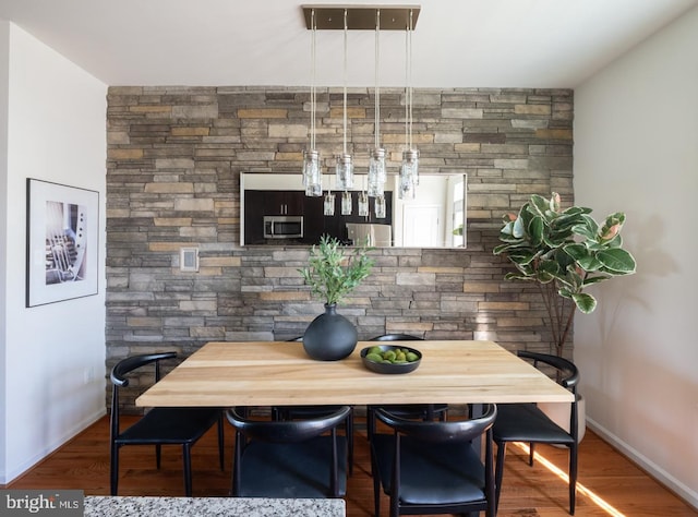 dining area featuring hardwood / wood-style flooring