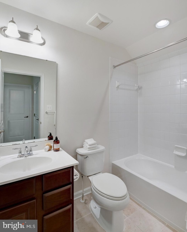 full bathroom featuring vanity, tiled shower / bath combo, toilet, and tile patterned floors