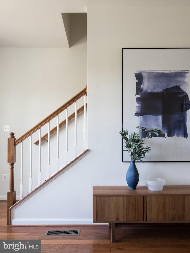 staircase featuring hardwood / wood-style flooring