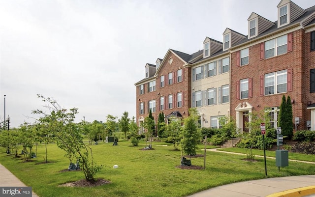 view of home's community featuring a lawn