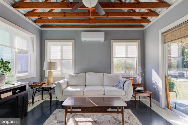 living room with a wall mounted air conditioner, beamed ceiling, plenty of natural light, and ceiling fan