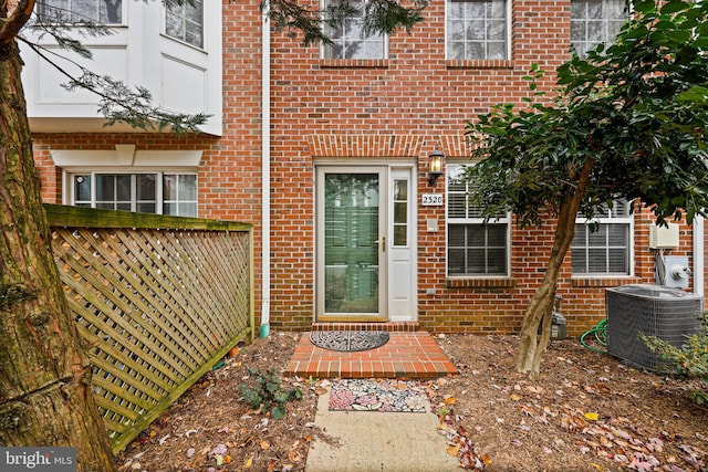 doorway to property featuring central AC