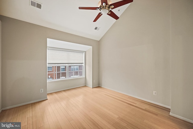 unfurnished room featuring lofted ceiling, ceiling fan, and light wood-type flooring