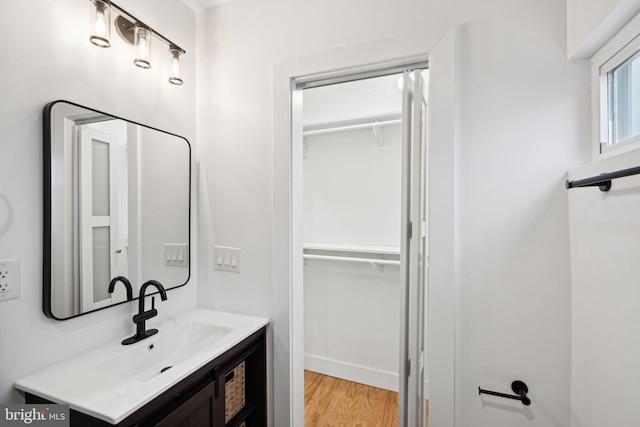 bathroom with vanity and hardwood / wood-style flooring