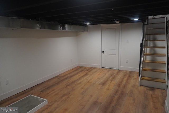 basement featuring hardwood / wood-style flooring