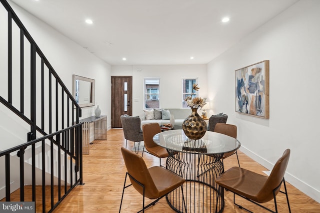 dining area with light hardwood / wood-style floors