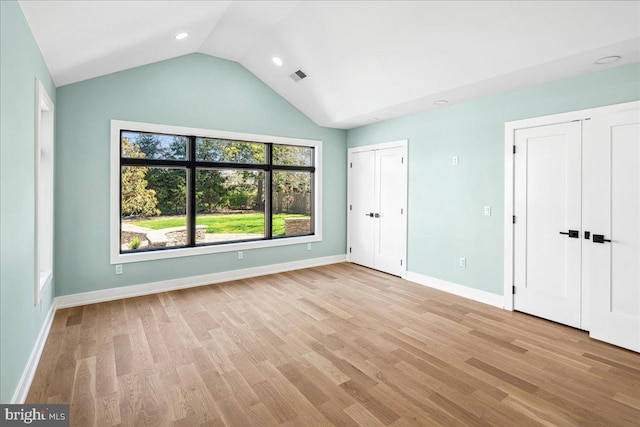 261 Moore St, Princeton, NJ 08540 - unfurnished bedroom featuring lofted ceiling, light wood-style floors, visible vents, and baseboards
